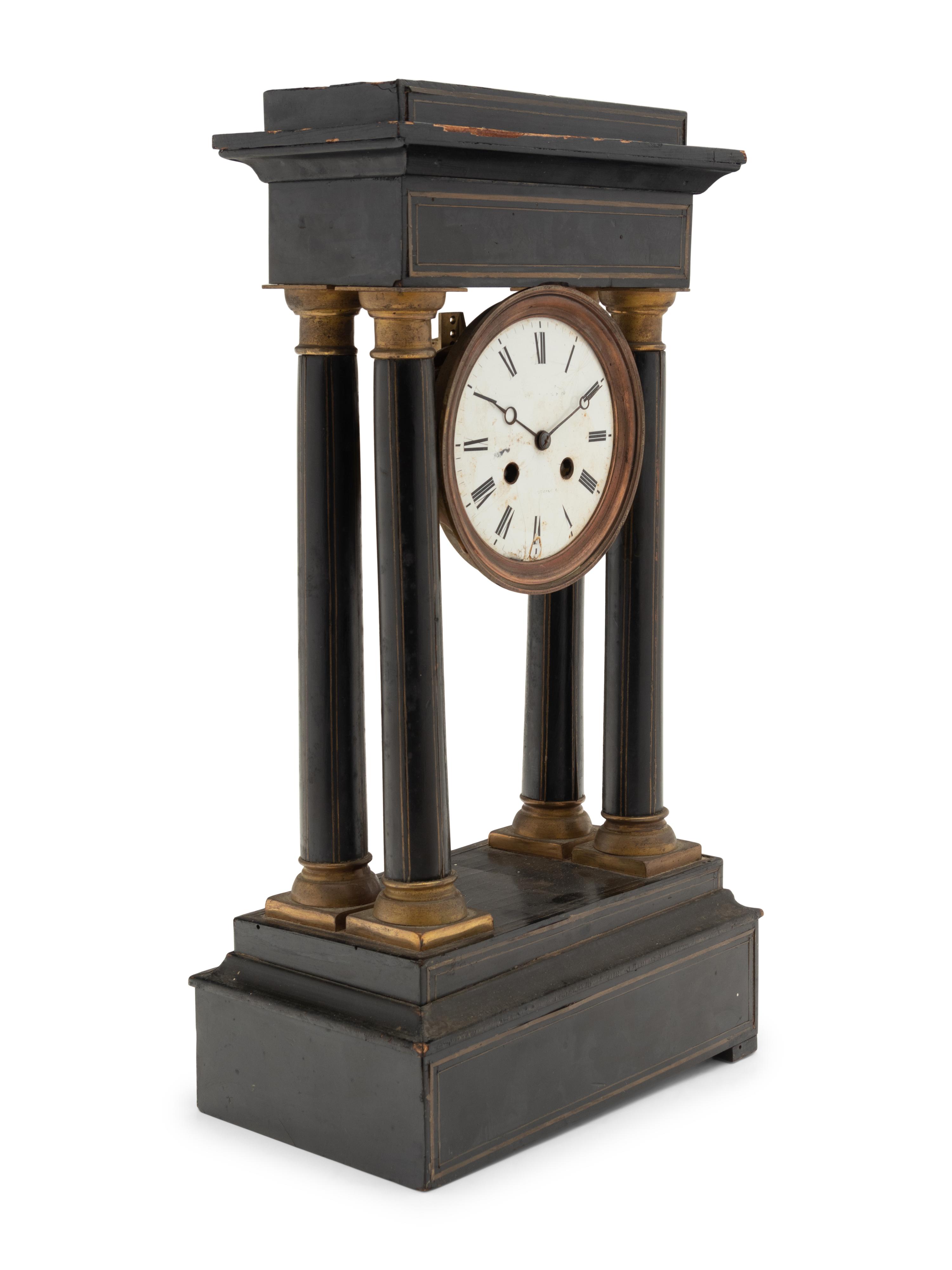 A Charles X Ebonized Mantel Clock