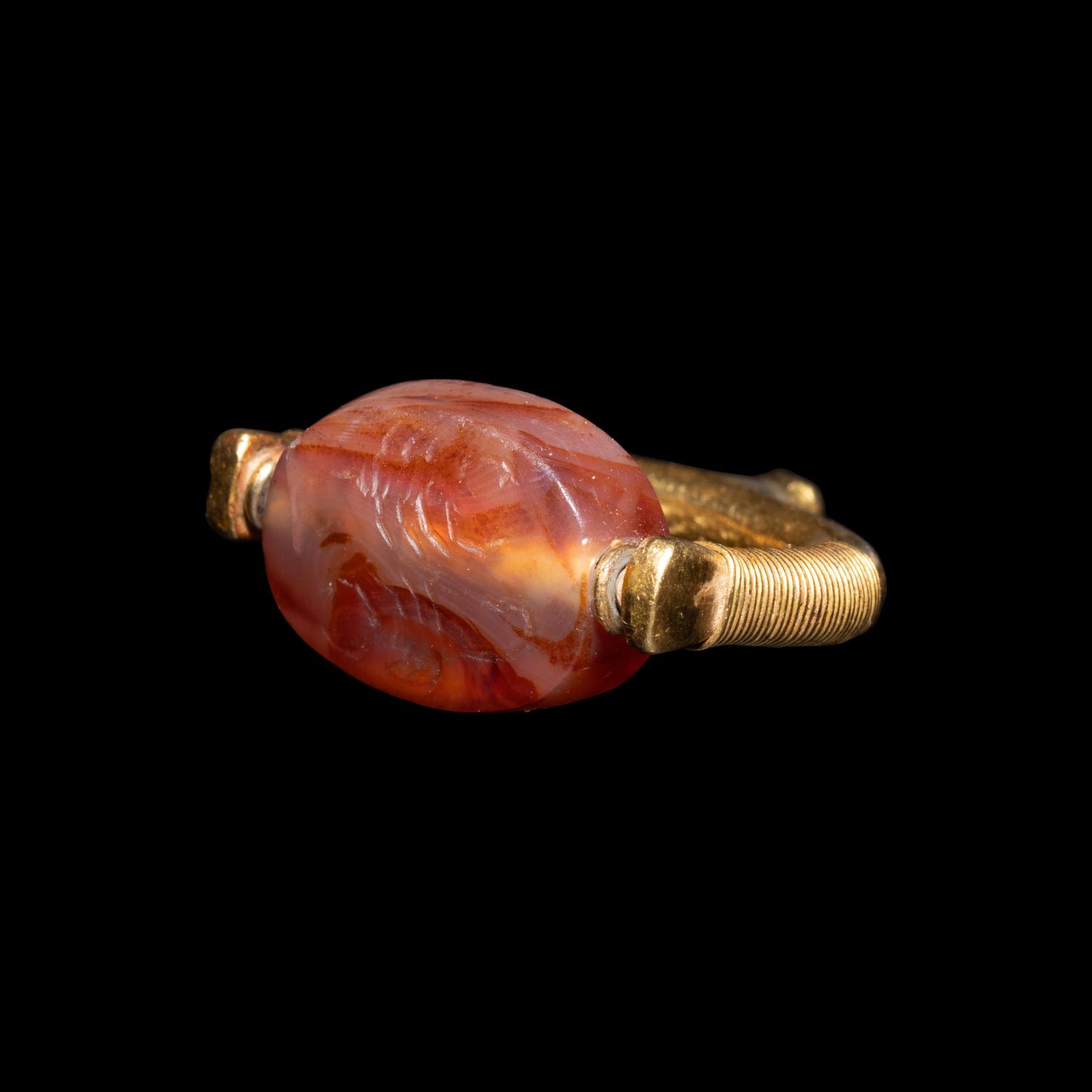 A Phoenician or Cypriot Gold and Carnelian Swivel Ring with Two Scorpions
