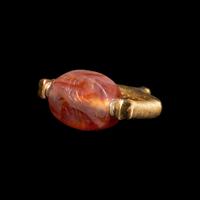 A Phoenician or Cypriot Gold and Carnelian Swivel Ring with Two Scorpions