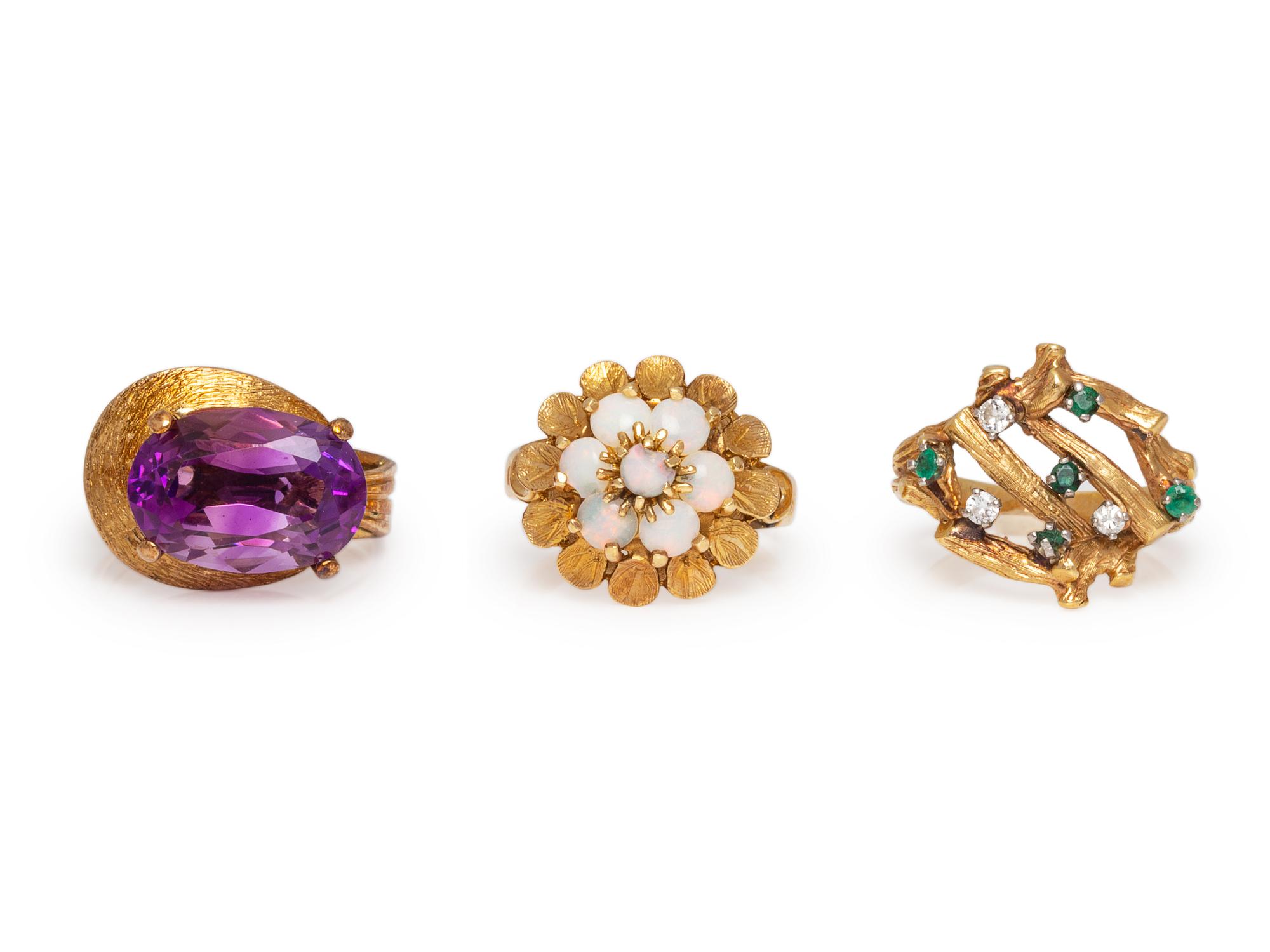 A Collection of 14 Karat Yellow Gold and Multigem Rings,