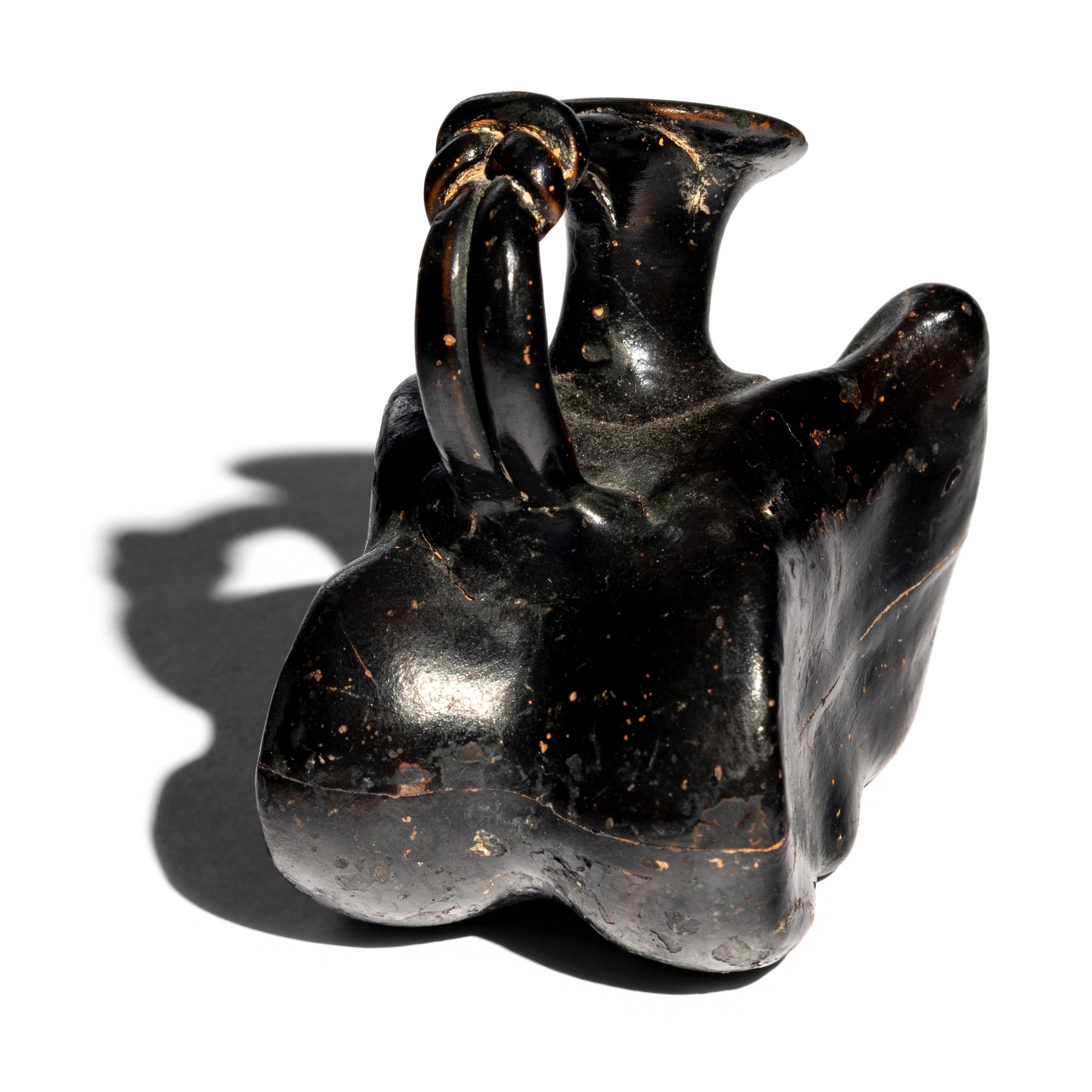A Greek Black-Glazed Figural Askos