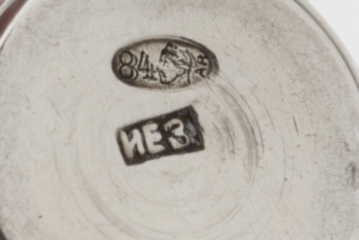 A Group of Eleven Russian Silver Beakers, Various Makers, Late 19th/Early 20th Century, each having a flared rim, the bodies worked to