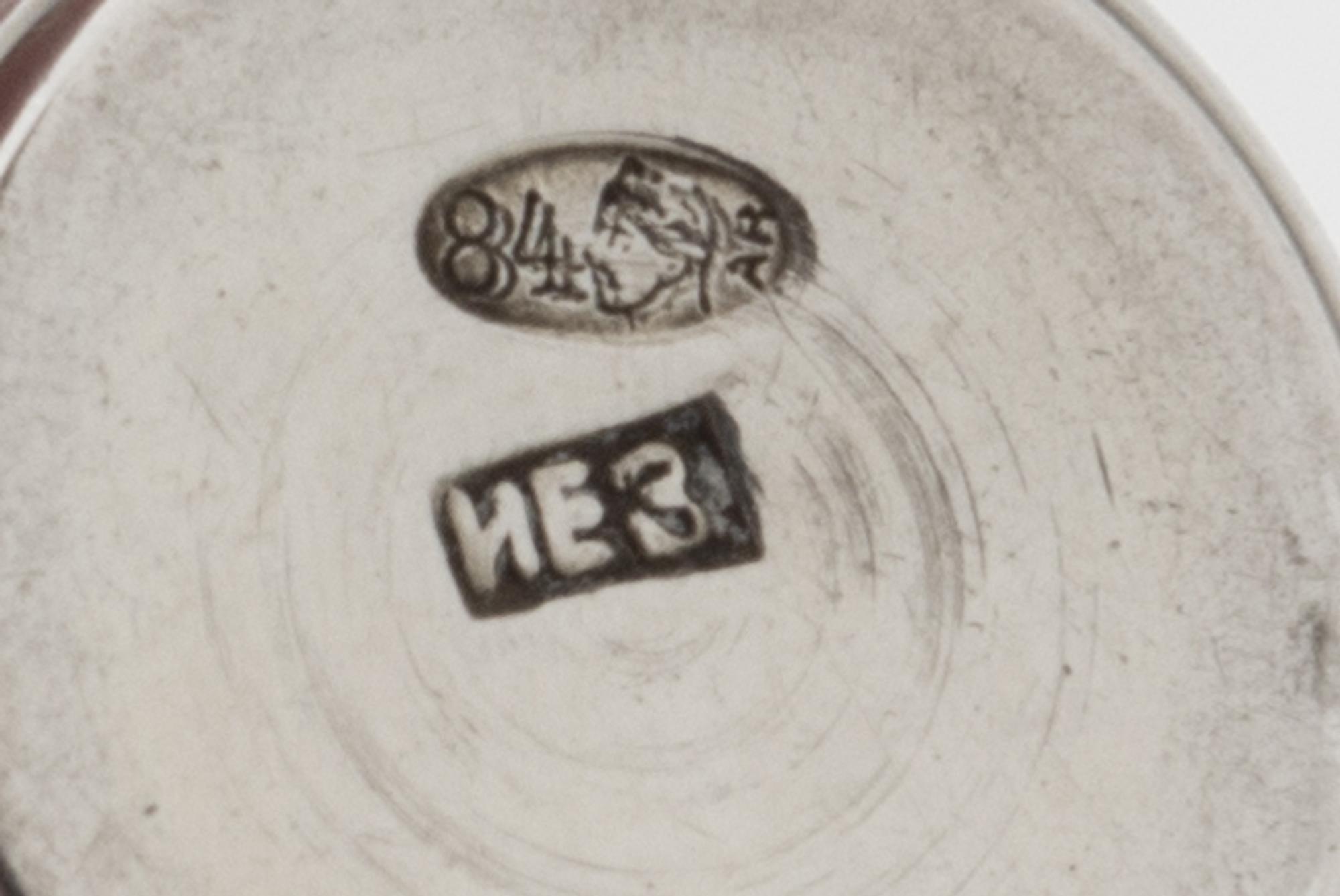 A Group of Eleven Russian Silver Beakers, Various Makers, Late 19th/Early 20th Century, each having a flared rim, the bodies worked to