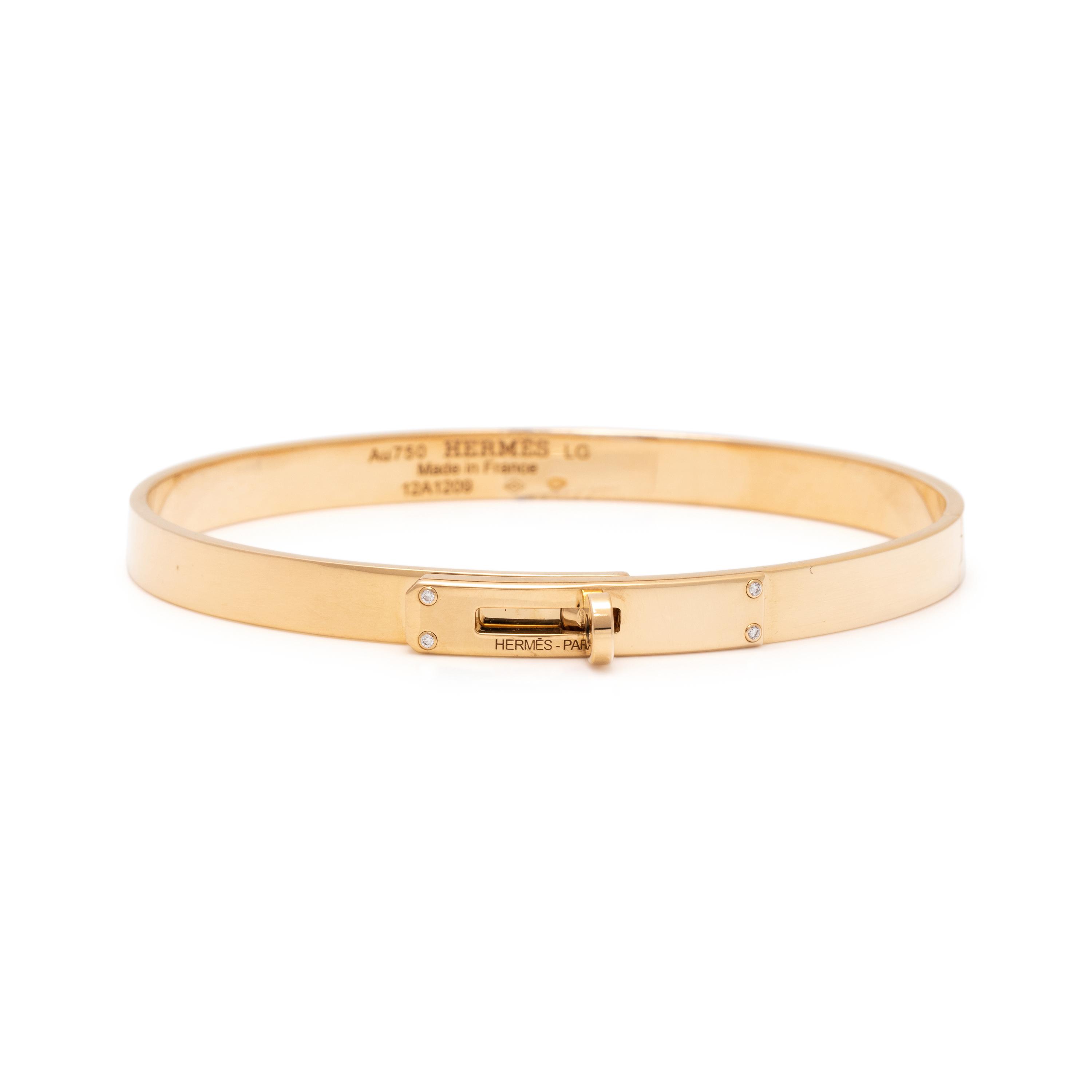 HERMÈS, YELLOW GOLD AND DIAMOND 'KELLY' BANGLE BRACELET
