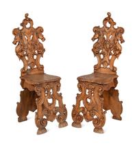 A Pair of Italian Carved Walnut Sgabello Chairs