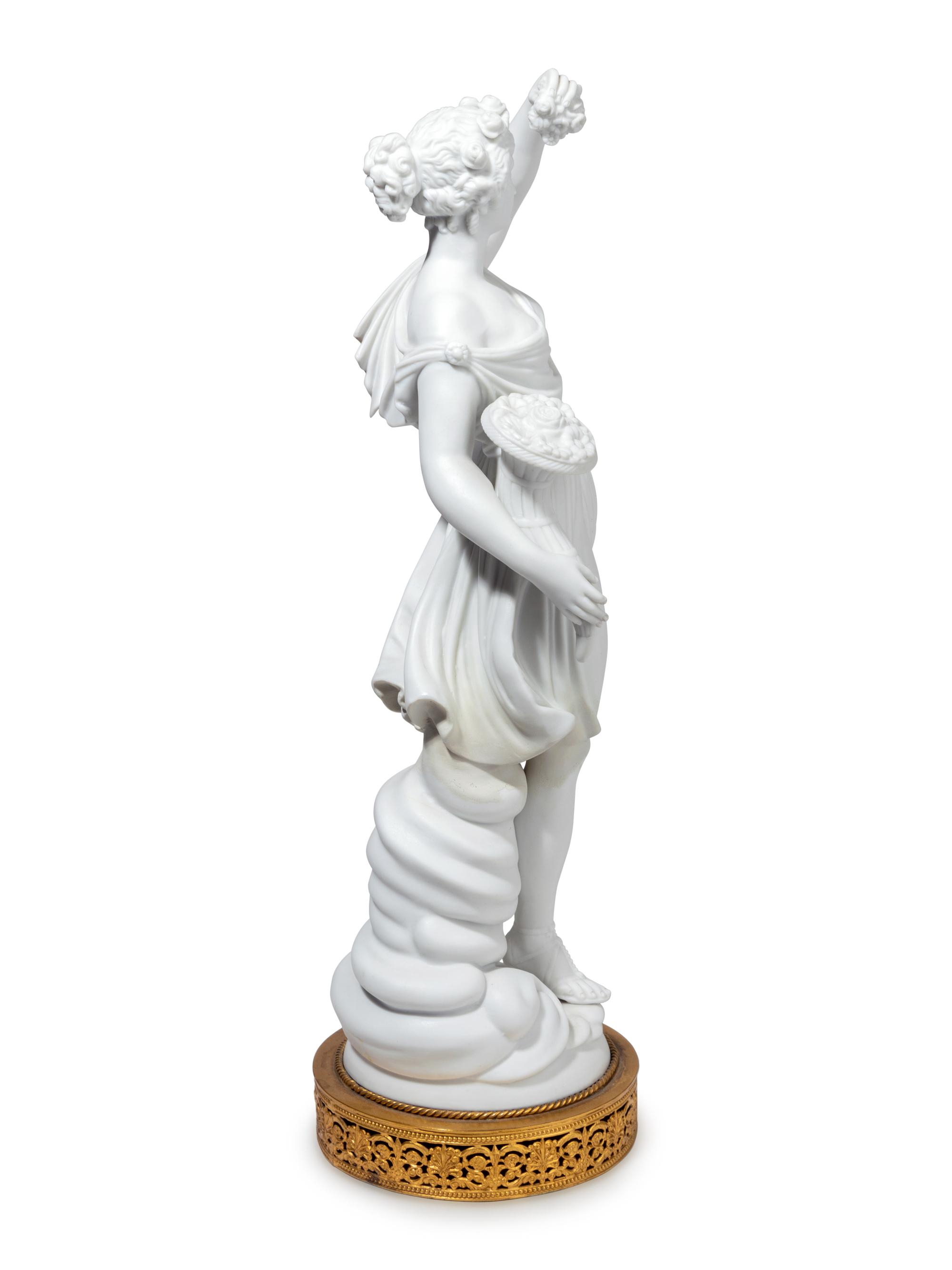 A Pair of Gilt Metal Mounted Bisque Porcelain Figures