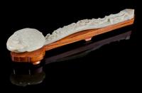 A Carved Celadon Jade Ruyi Scepter Length 15 inches. — 19TH CENTURY