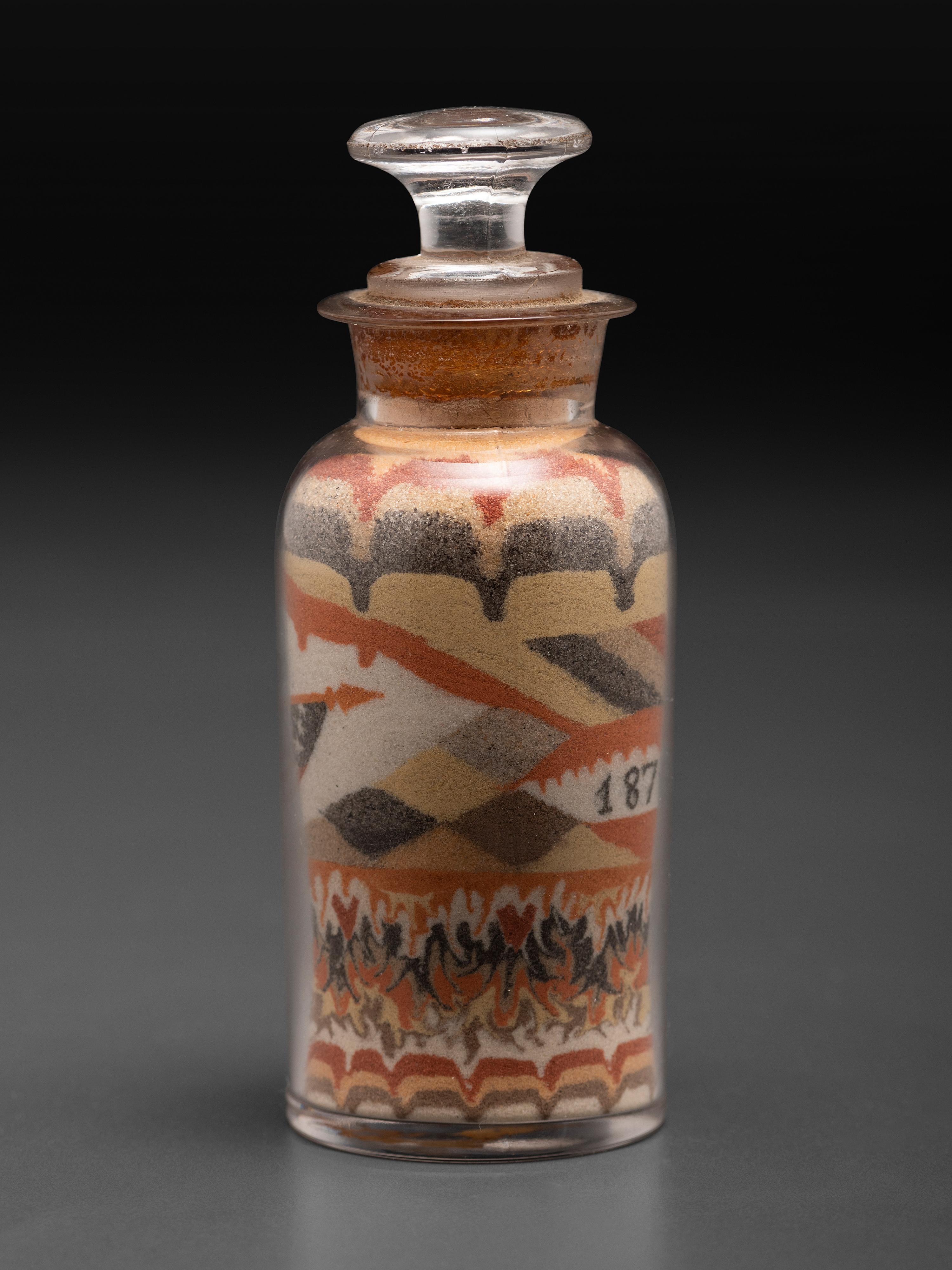 An Early Andrew Clemens (American, 1857-1894) Eagle Sand Bottle