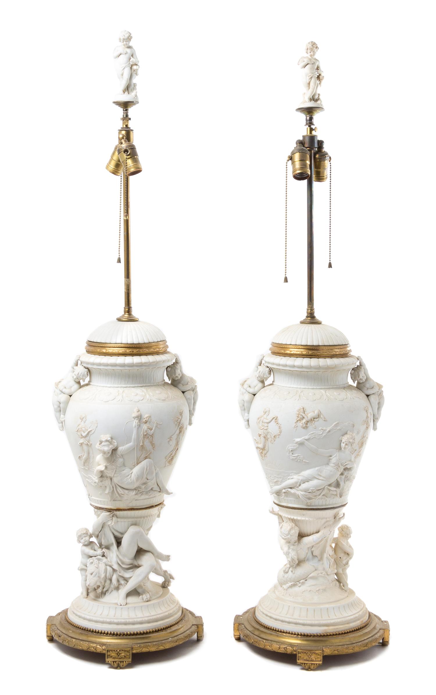 A Pair of Gilt Bronze Mounted Bisque Porcelain Urns Height 44 1/2 inches.