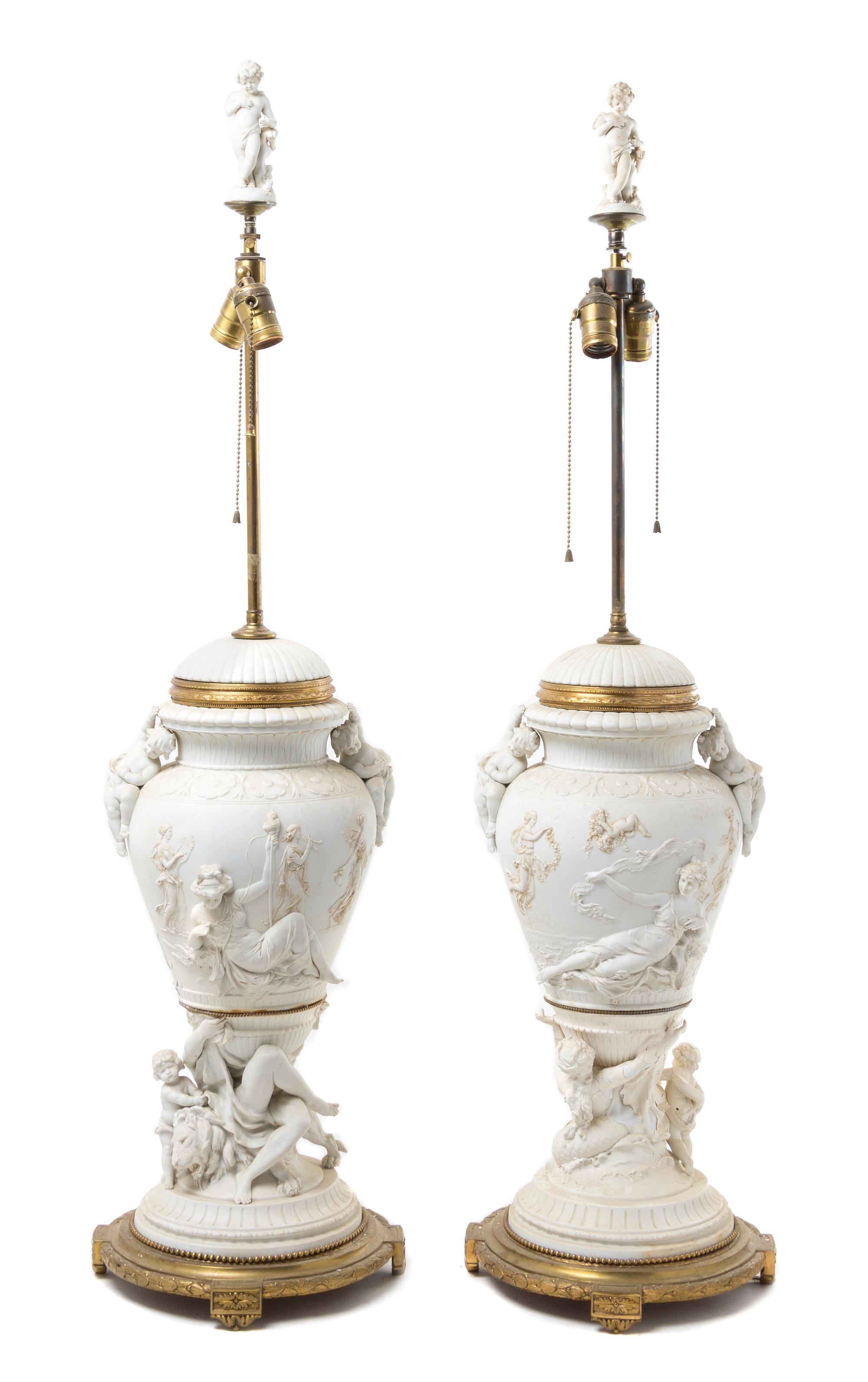 A Pair of Gilt Bronze Mounted Bisque Porcelain Urns Height 44 1/2 inches.