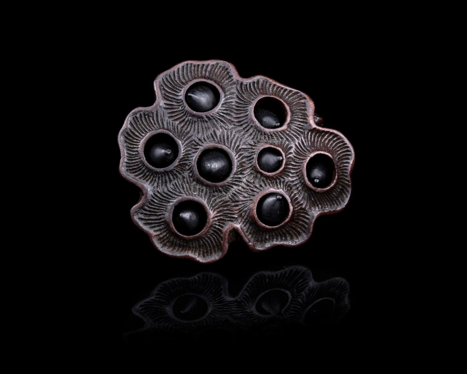 A Japanese Wood Netsuke of Lotus Pod