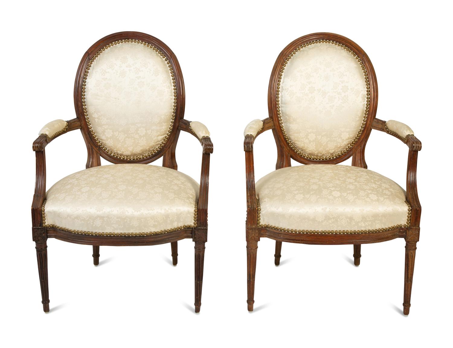 A Pair of Louis XVI Walnut Fauteuils en Cabriolet