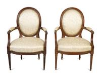 A Pair of Louis XVI Walnut Fauteuils en Cabriolet