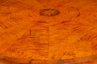 An Austrian Part Ebonized and Inlaid Ash and Walnut Center Table