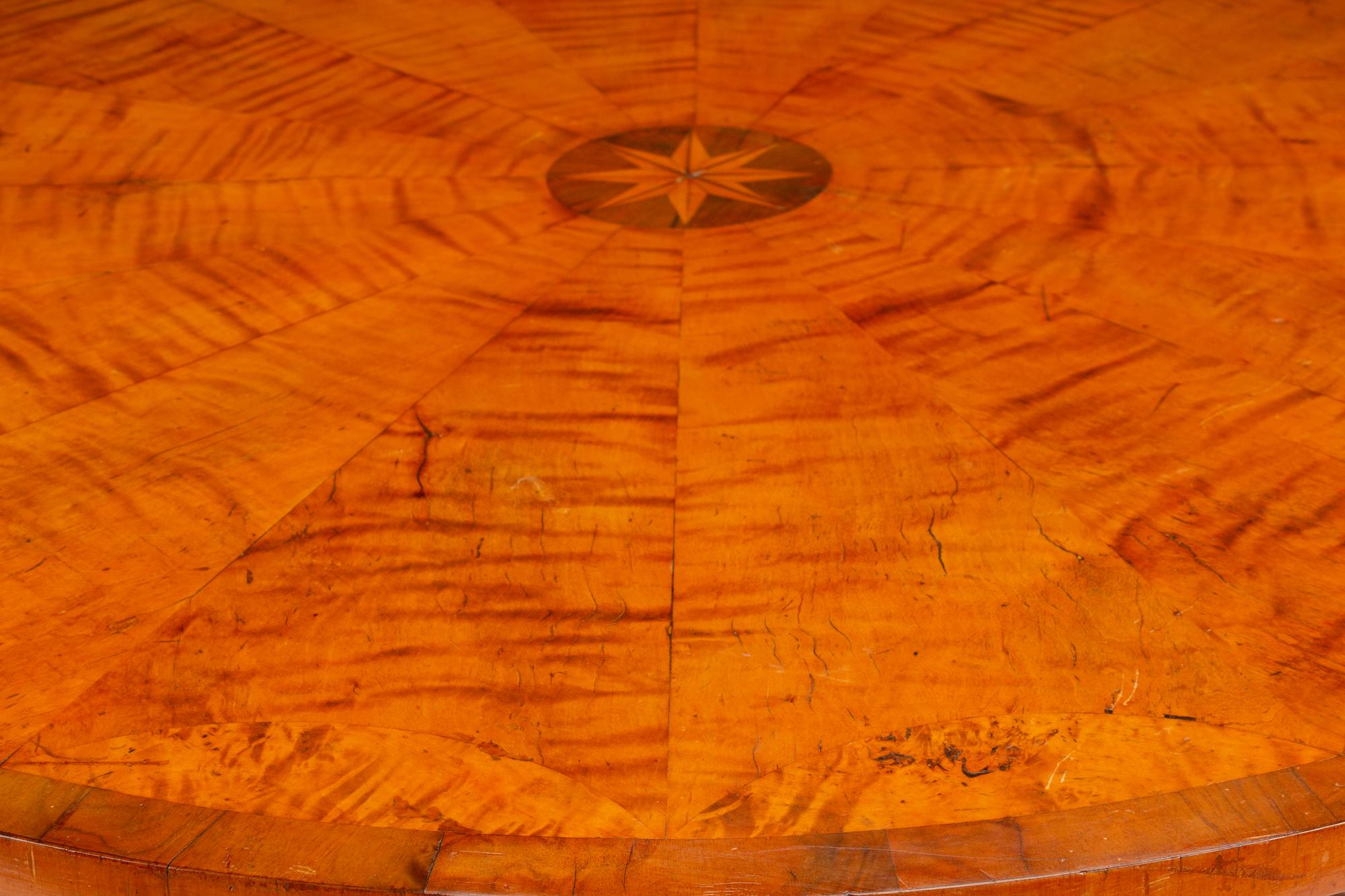 An Austrian Part Ebonized and Inlaid Ash and Walnut Center Table