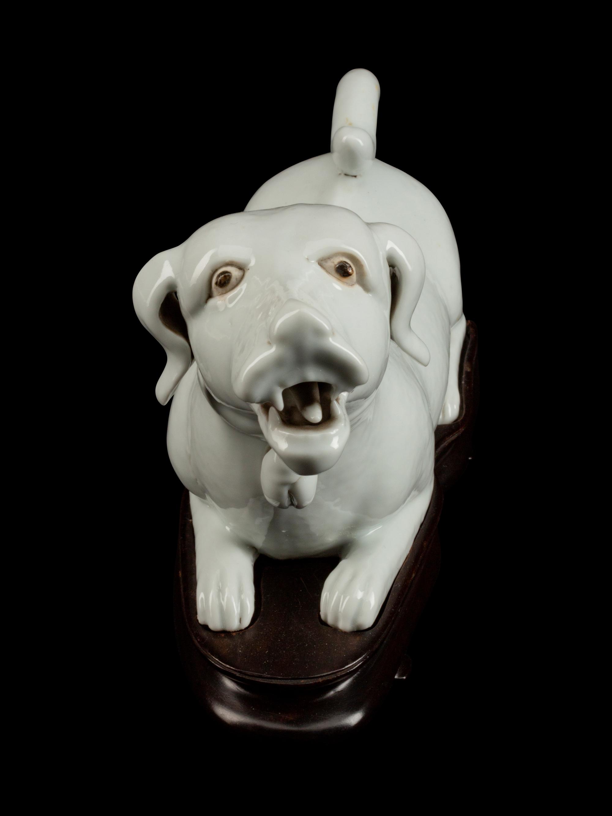 A Chinese Export Blanc de Chine Porcelain Figure of a Recumbent Dog — 19TH CENTURY