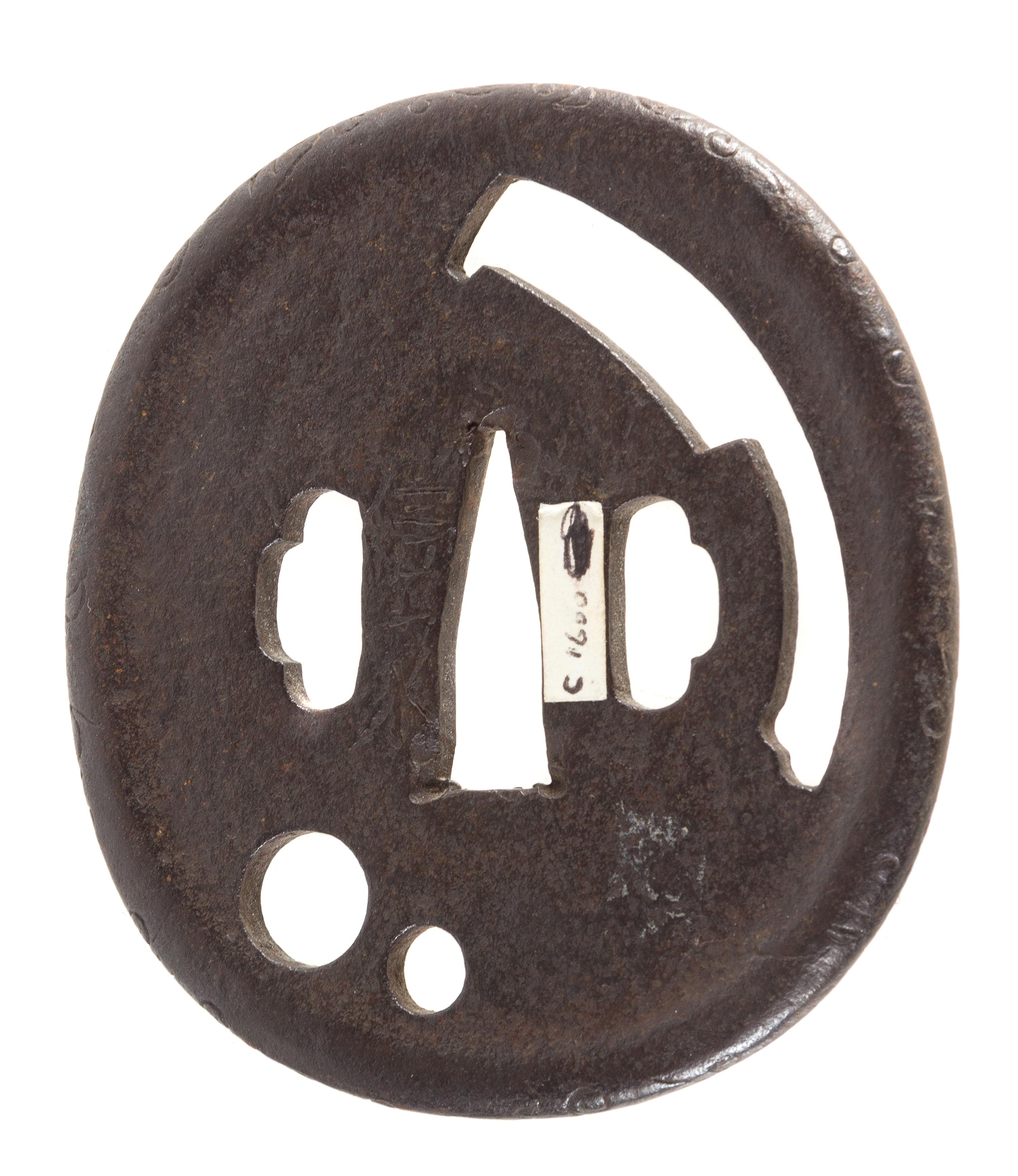 An Iron Tsuba Height 3 1/4 inches. — 17TH CENTURY