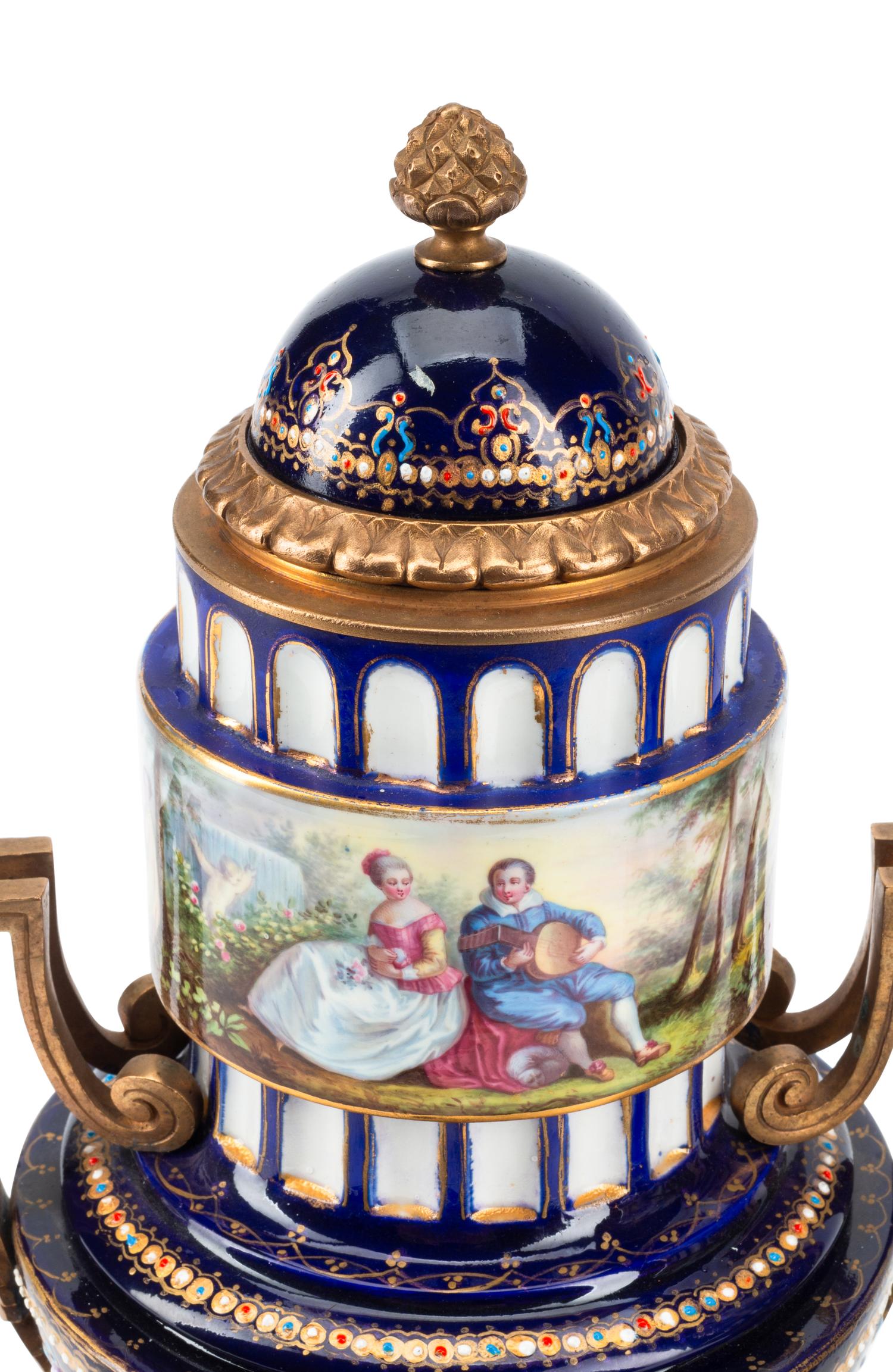 A Pair of Gilt Bronze Mounted Sèvres Style Porcelain Urns