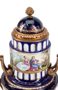 A Pair of Gilt Bronze Mounted Sèvres Style Porcelain Urns
