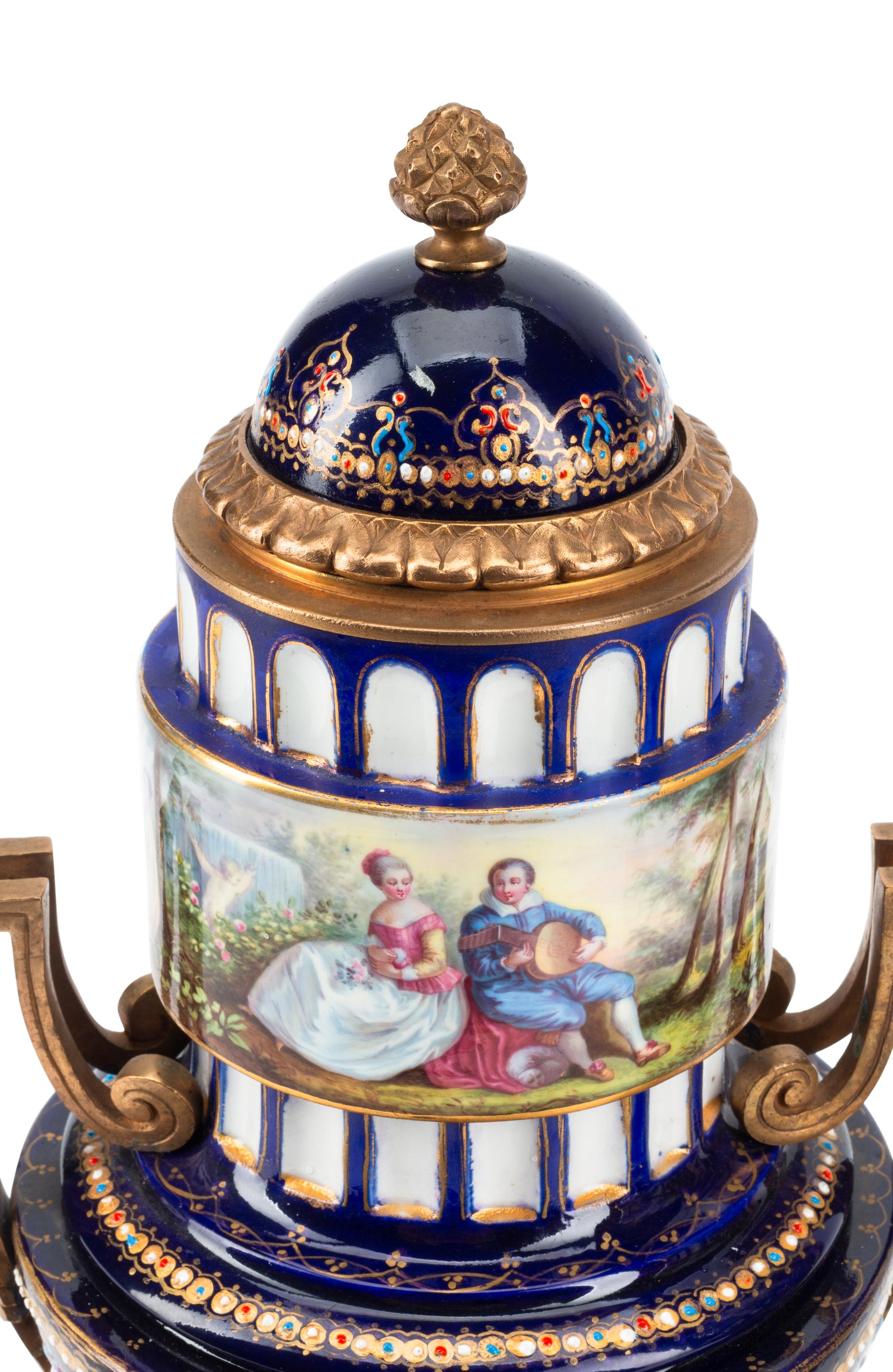 A Pair of Gilt Bronze Mounted Sèvres Style Porcelain Urns