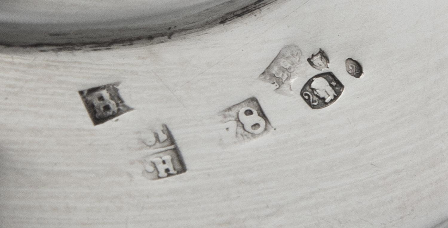 A Pair of Russian Silver Candlesticks, Maker's Mark Obscured, 1835, each set on a circular base bearing a monogram and coronet over fol