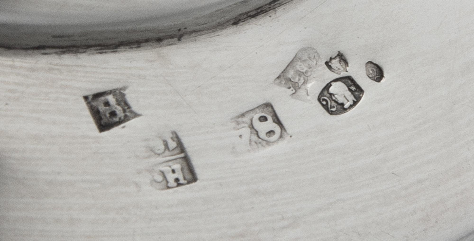 A Pair of Russian Silver Candlesticks, Maker's Mark Obscured, 1835, each set on a circular base bearing a monogram and coronet over fol