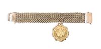 A 14 Karat Yellow Gold Bracelet with a Mexico 50 Pesos Gold Coin Charm, 66.80 dwts.