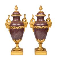 A Pair of Louis XVI Style Gilt Bronze Mounted Porphyry Urns
