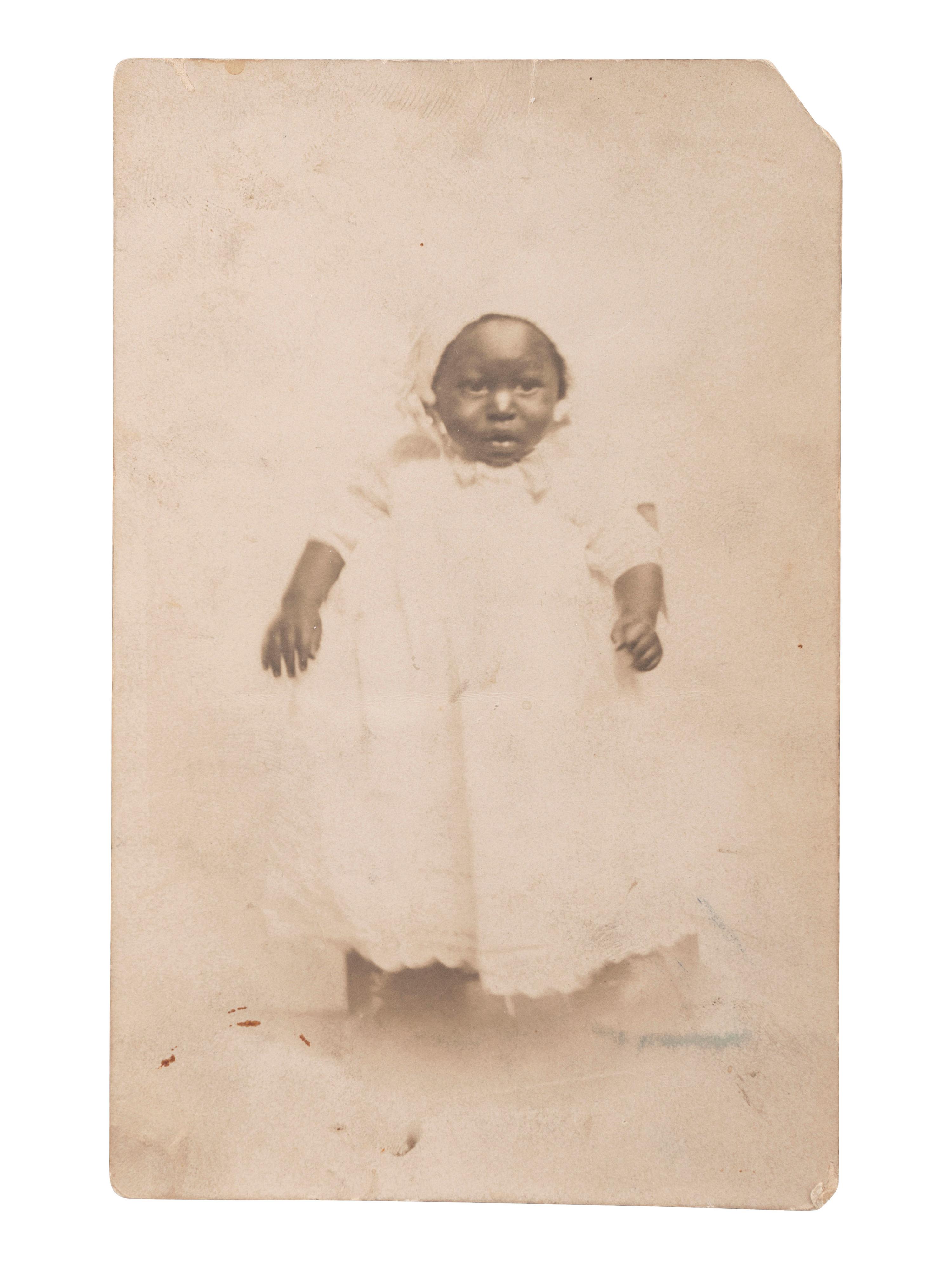 [EARLY PHOTOGRAPHY]. A group of 6 photographs of African American subjects, highlighted by lovely portrait of African American woman with white child.