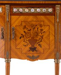 A Louis XVI Style Marquetry, Gilt Metal and Porcelain Mounted Side Cabinet