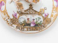 Three Meissen Painted and Parcel Gilt Porcelain Cup and Saucer Sets, a Covered Cup and Two Spoons