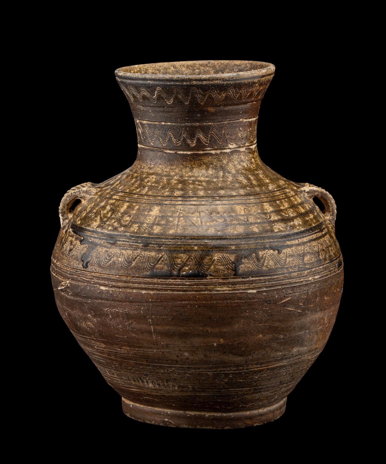 A Chinese Dark Green Glazed Pottery Handled Vase