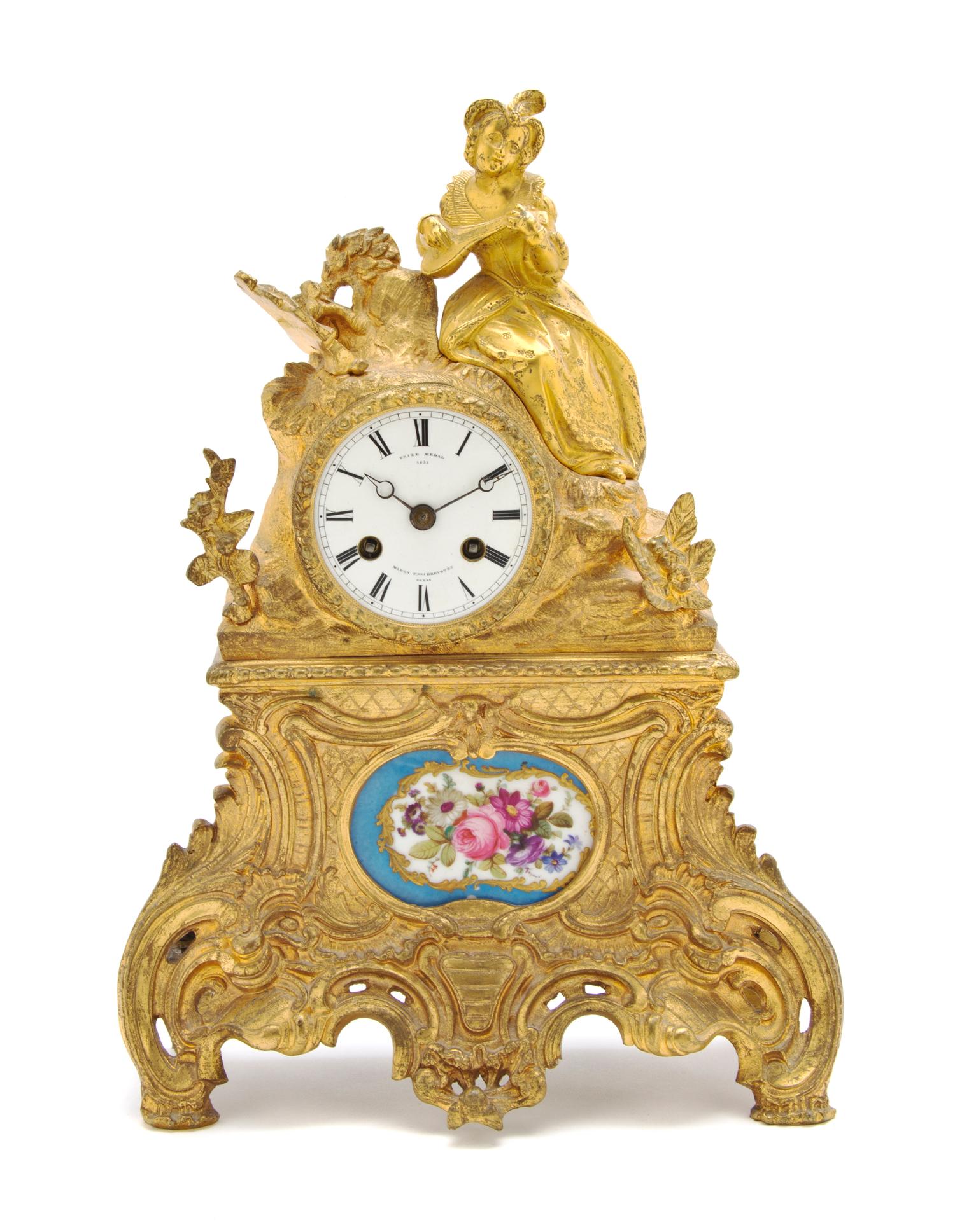 A French Gilt Metal and Sevres Style Porcelain Inset Figural Mantel Clock, Miroy Freres, Height 13 1/4 inches.