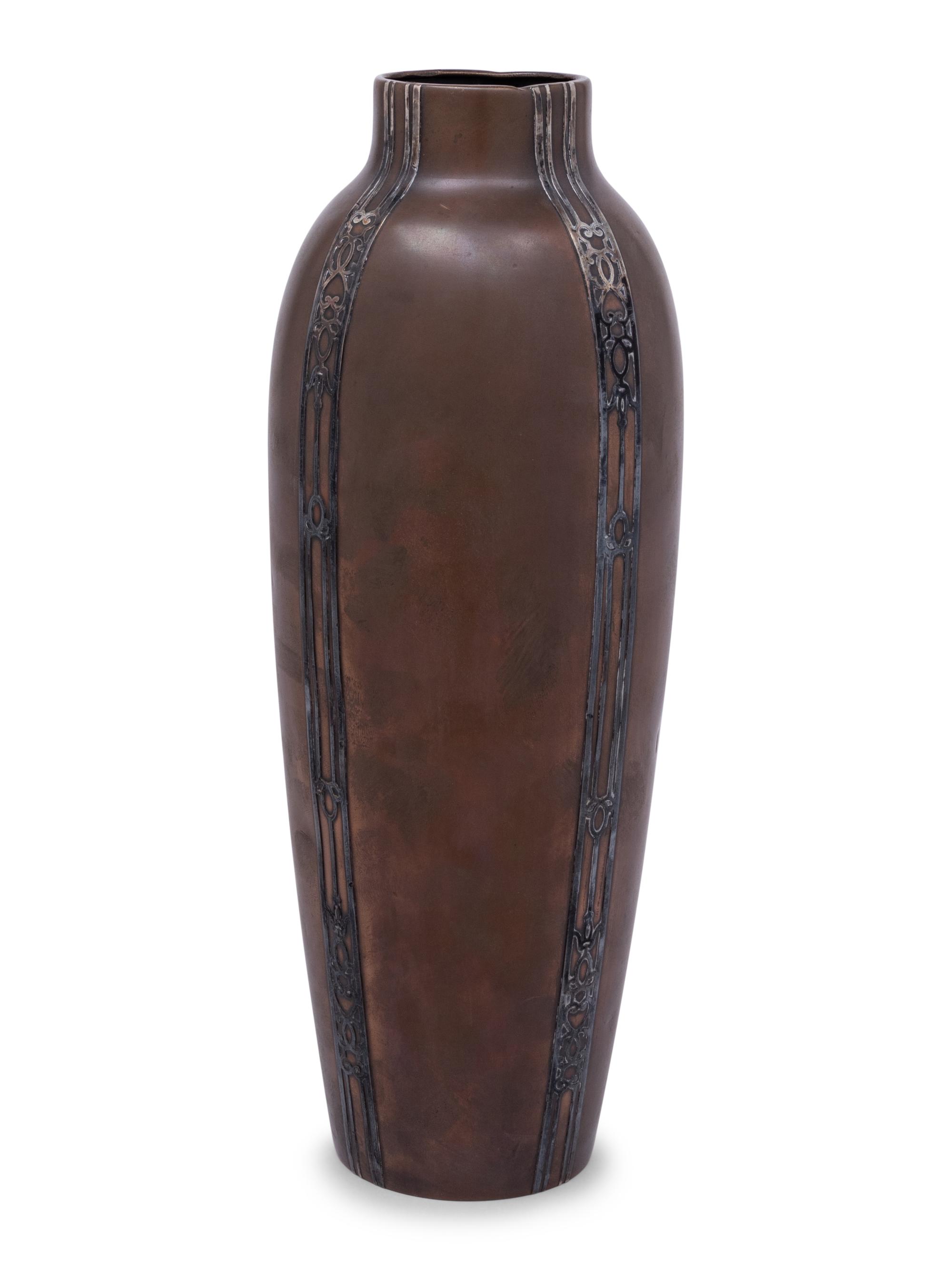 A Heintz Silver on Bronze Base