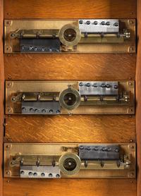 A Symphonion 13 5/8-Inch Eroica Triple Disk Upright Music Box