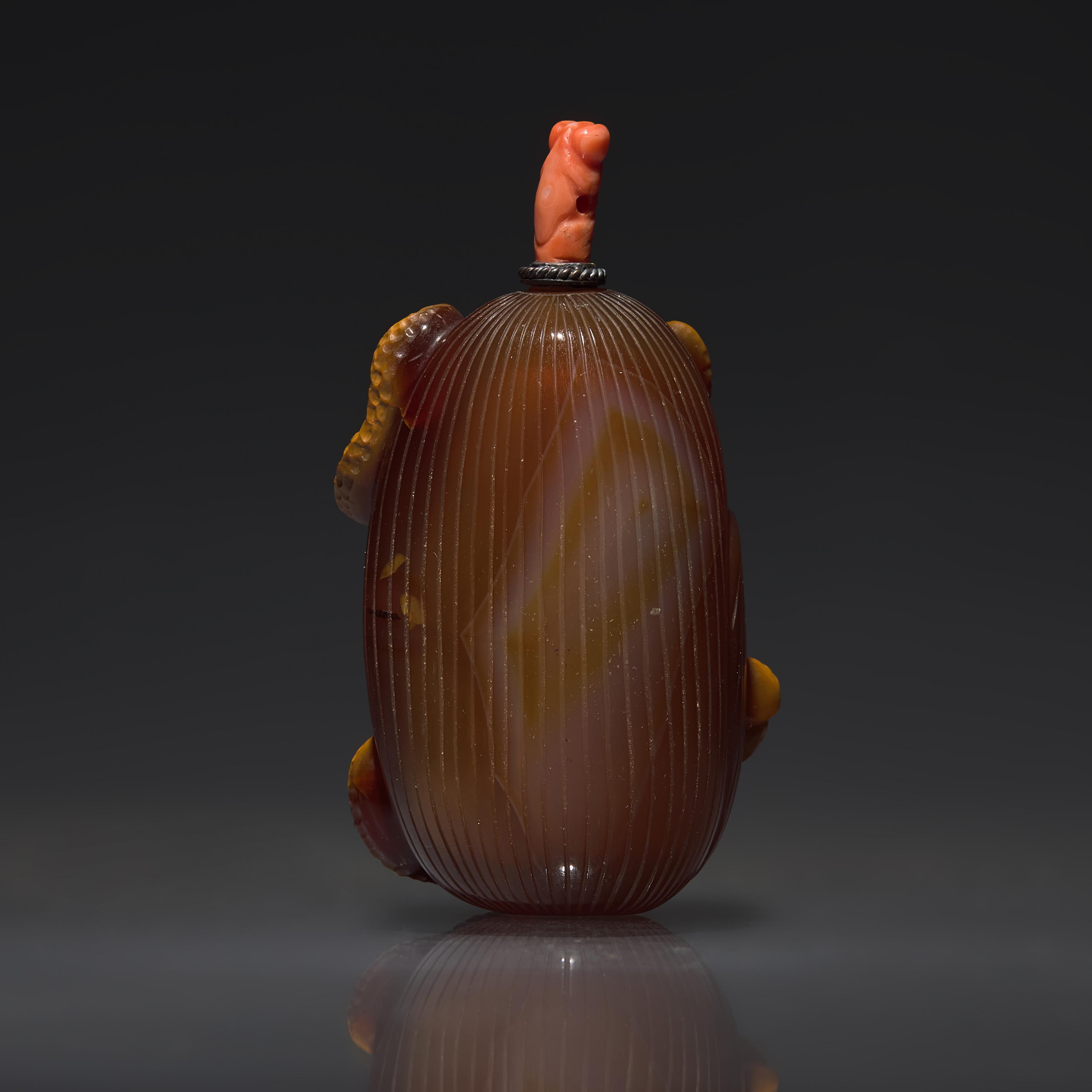 A Chinese Carved Agate "Jujubes and Peanuts" Snuff Bottle, Qing Dynasty, Circa 1800-1850
