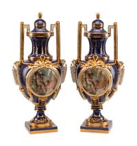 A Pair of Sèvres Style Porcelain Urns