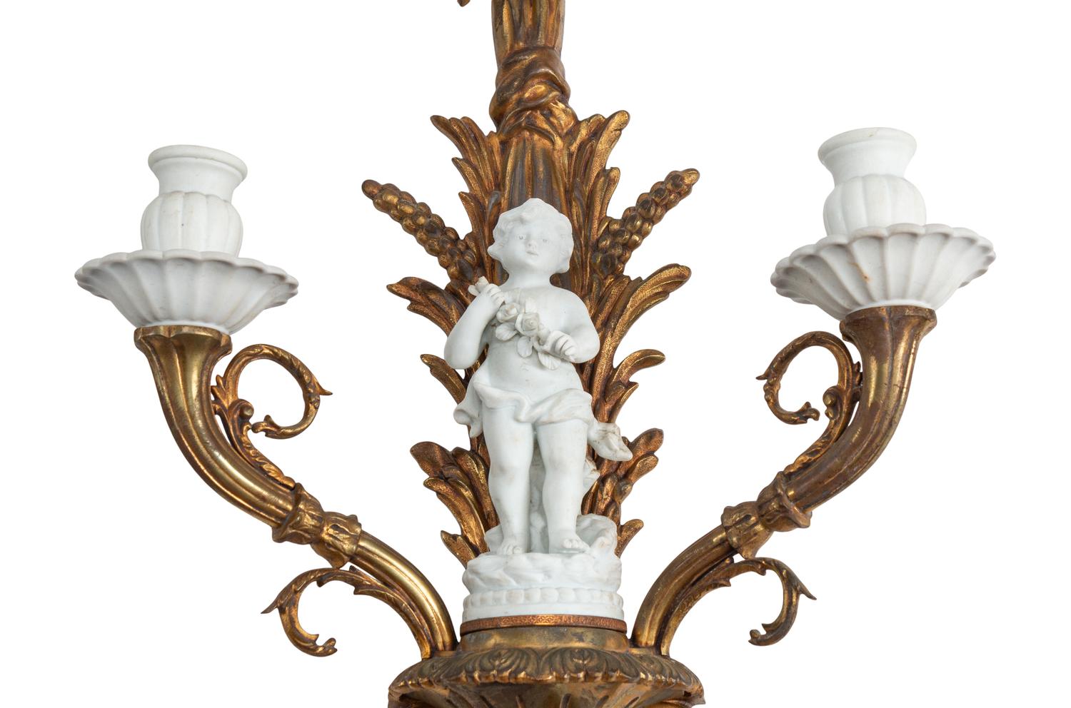 A Pair of Continental Gilt Bronze and Bisque Porcelain Two-Light Sconces
