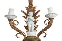 A Pair of Continental Gilt Bronze and Bisque Porcelain Two-Light Sconces