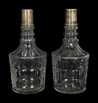 Four American Silver Mounted Cut Glass Decanters
