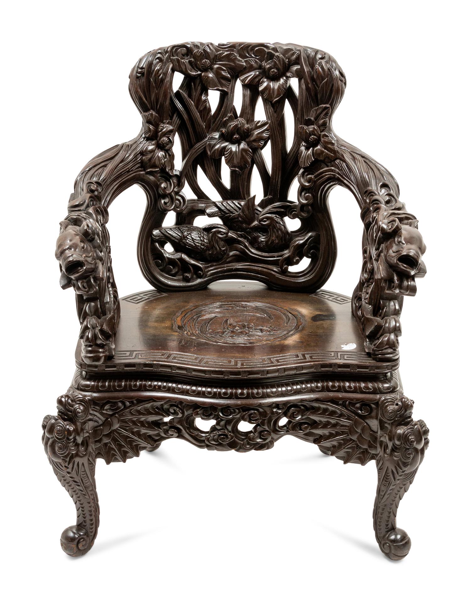 A Chinese Export Carved Hardwood Armchair