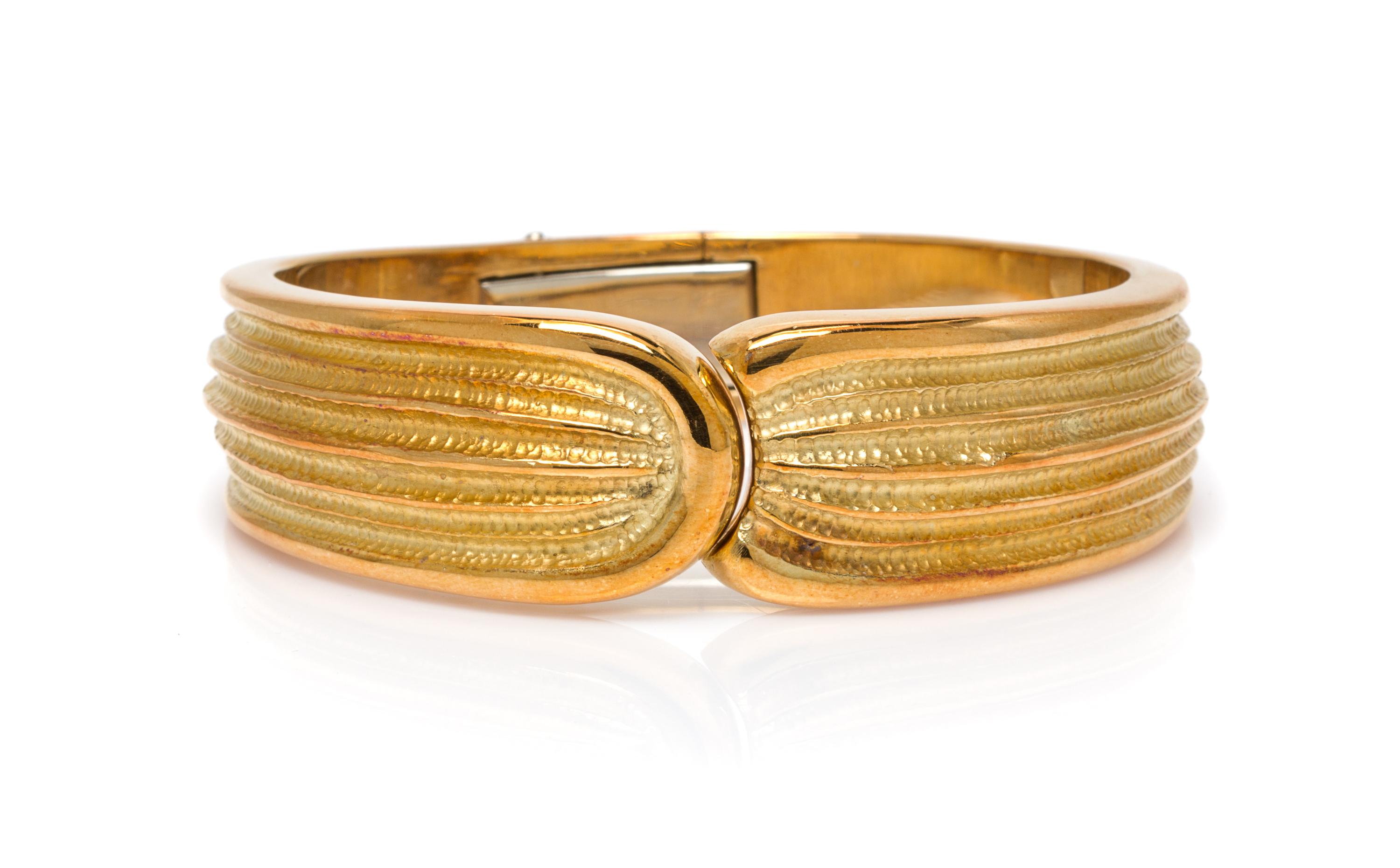 An 18 Karat Textured Yellow Gold Bangle Bracelet, 40.10 dwts.