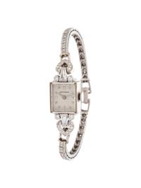 MOVADO, WHITE GOLD AND DIAMOND WRISTWATCH