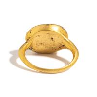 A Roman Gold and White Glass Finger Ring with a Male Portrait Head (Possibly a Young Hercules)