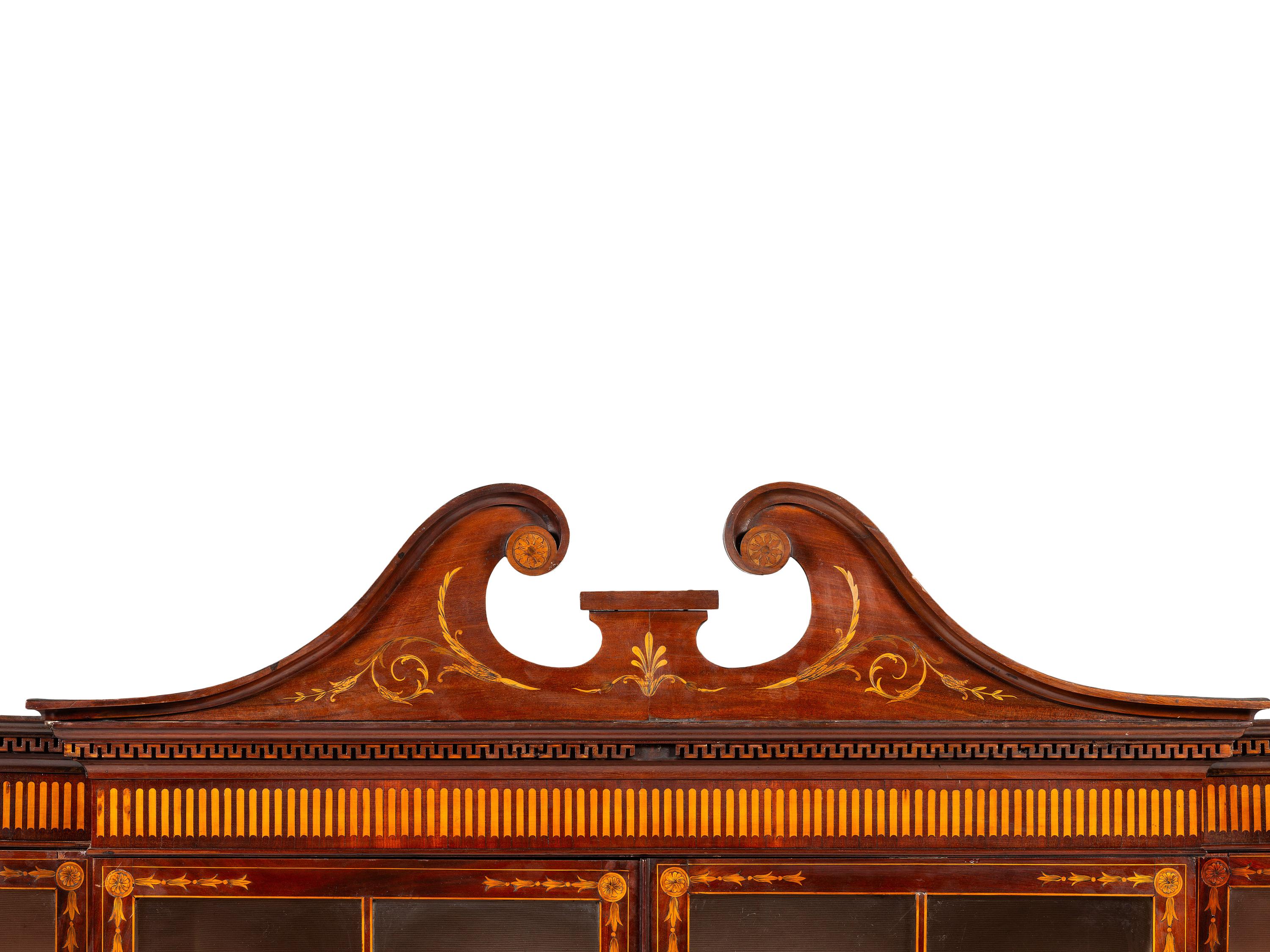 An English Mahogany and Marquetry Breakfront Bookcase