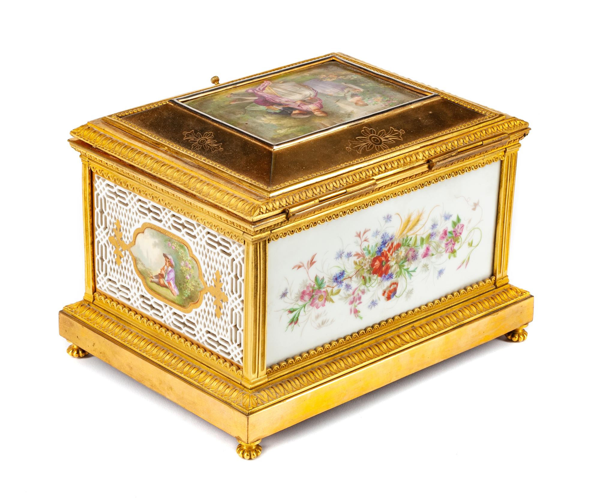 A French Gilt Bronze and Reticulated Porcelain Box