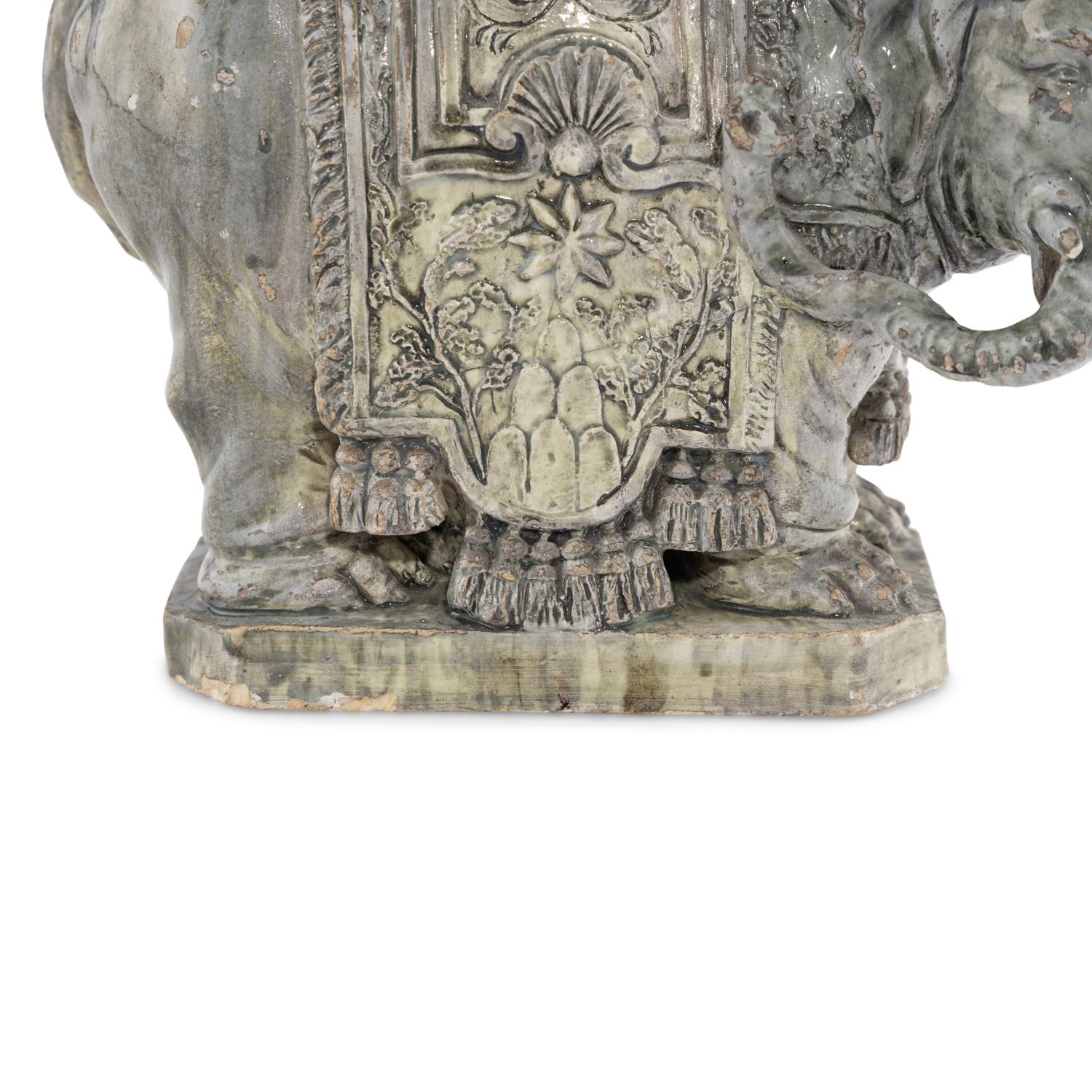 A Continental Gilt Bronze and Glazed Earthenware Elephant Obelisk