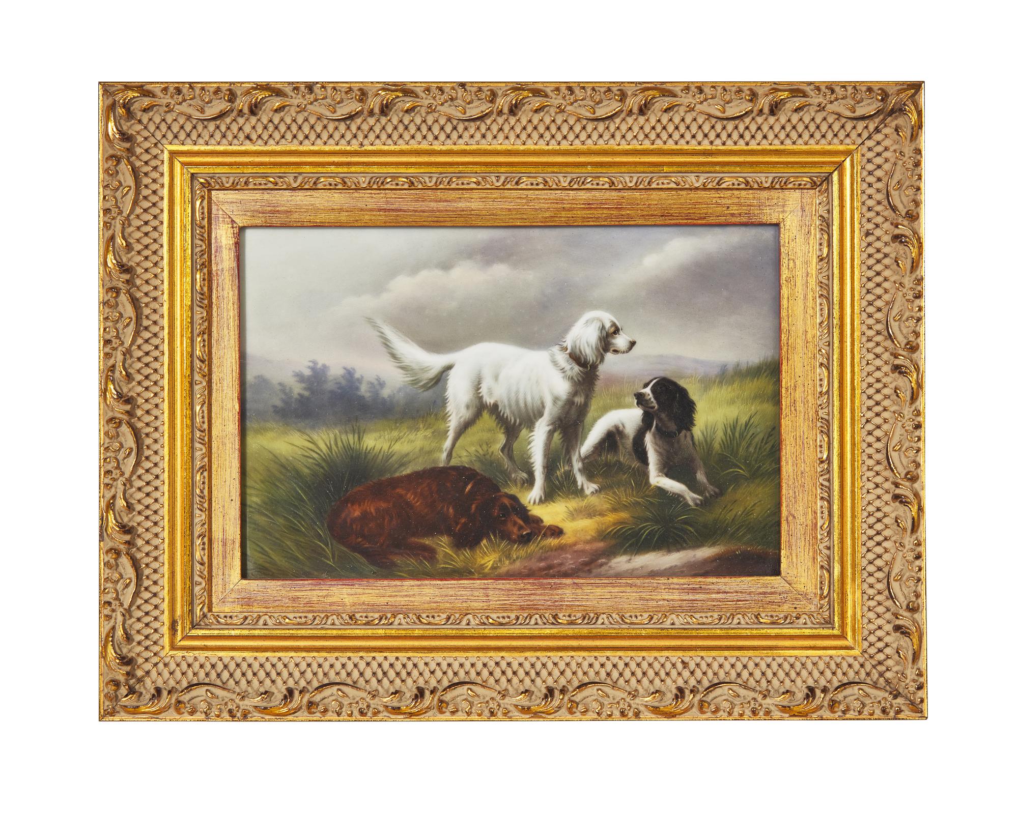 A German Hand-Painted Porcelain Plaque Depicting Three Spaniels