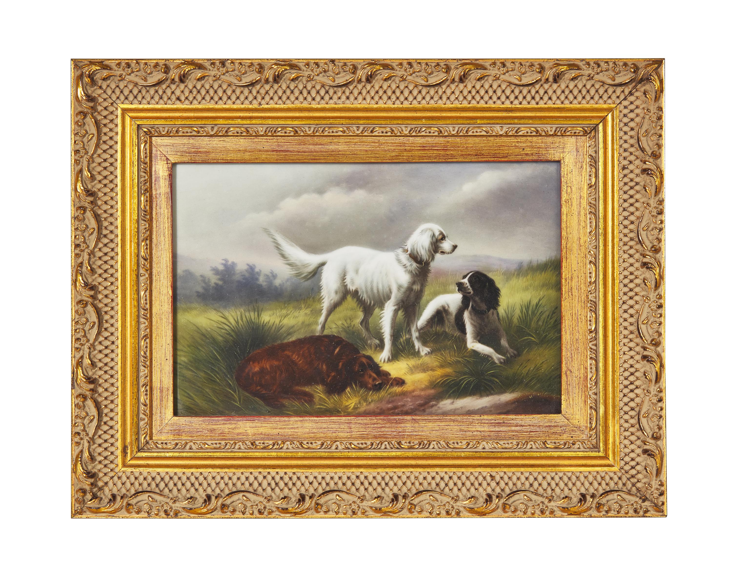 A German Hand-Painted Porcelain Plaque Depicting Three Spaniels