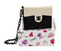 A Chanel Black and White Lucite Handbag, 6.75" x 5.5".